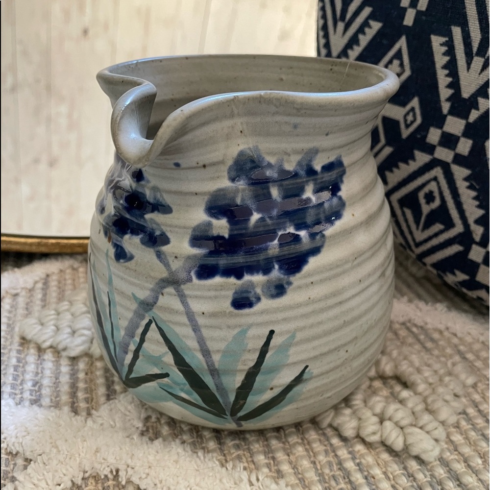 Handmade Pottery pitcher, pained with bluebonnets. 5.5 in tall 5 in wide.